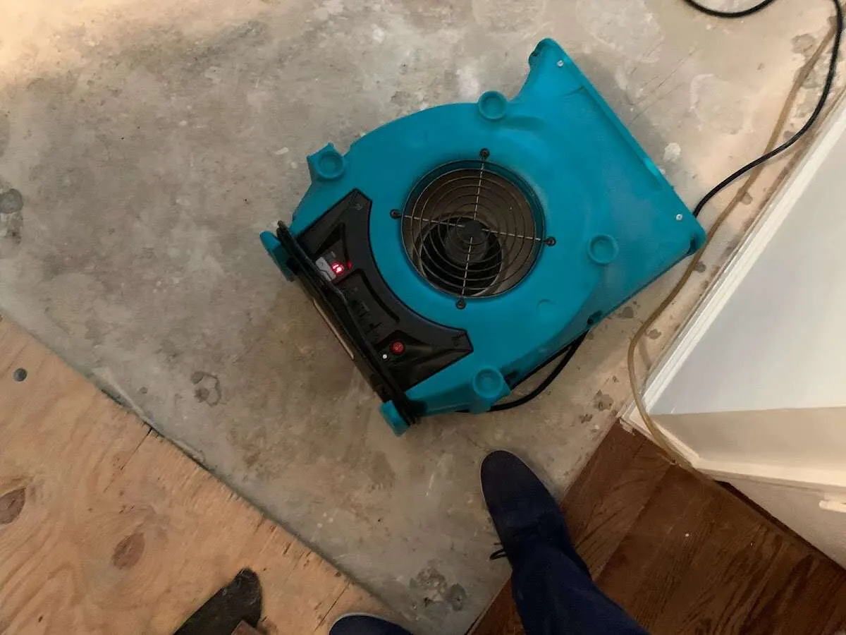 Air mover drying subfloor during Leak Detection & Repair in Connersville